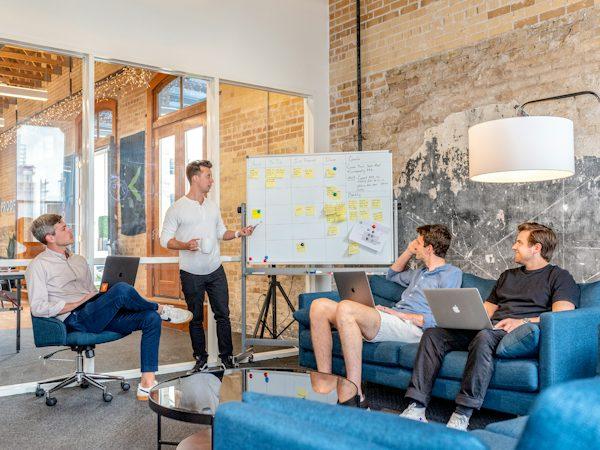 A team at a digital marketing agency in Clovis brainstorming growth ideas for a business.