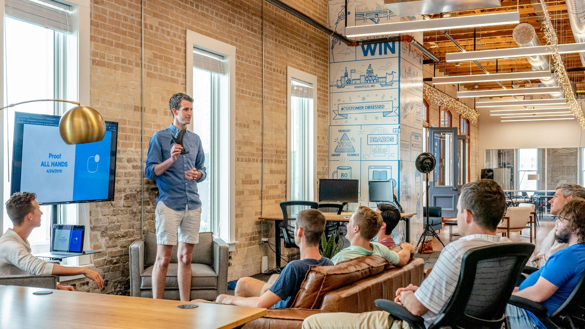 A presenter shares ideas with a team during a meeting, representing business lead generation in California.